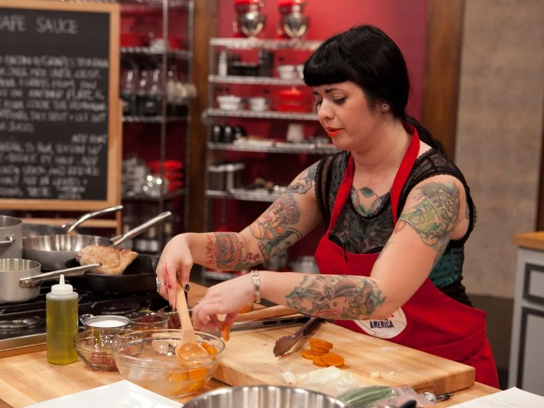 Crystal Lonneberg of the Red Team attempt to make Chef Anne's Pan seared pork chops with grape sauce as well as Garlic Yukon gold mashed potatoes or Hash brown potatoes or Herb roasted potatoes. The recruits were each given sacks of potatoes and a card telling them which pototo recipe they were to make, as seen on Food Networks Worst Cooks in America, Season 4