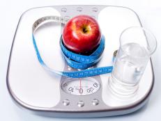 Weight scale ,apple and glass of water
