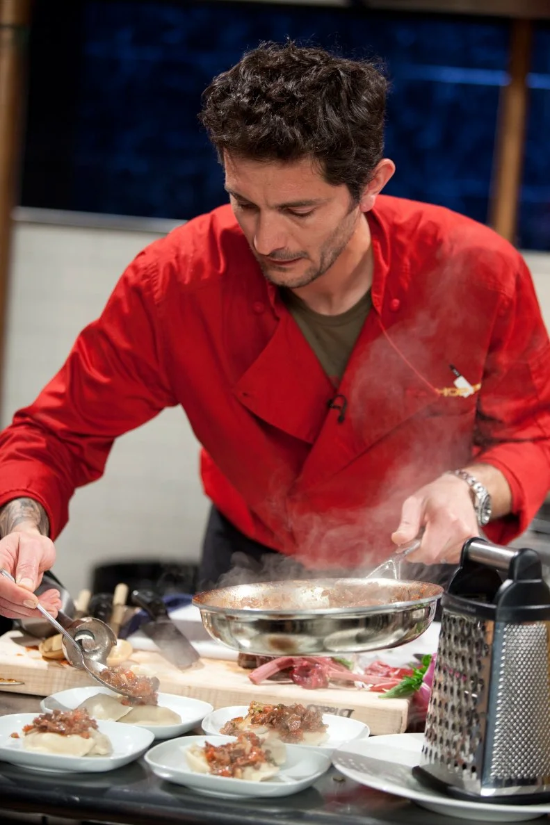 Chef Gabriele Corcos plates his entree, as seen on Food Network’s Chopped All Stars, Season 14.
