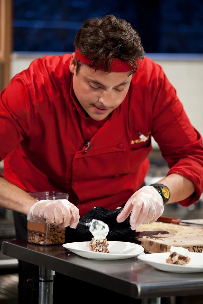 Chef Jeff Mauro finishes his dessert plate, as seen on Food Network’s Chopped All Stars, Season 14.
