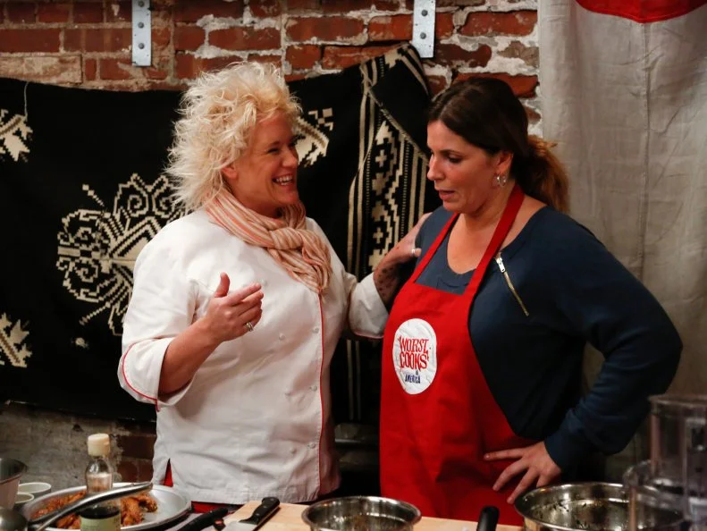 Red Team Leader Chef Anne Burrell is happy with the progress Red Team Recruit Suzanne Mangogna is making  with her "Wild Hog Teriyaki Chicken Wings," and her additional appetizer: Grilled Proschiutto Wrapped Figs Stuffed With Gorgonzola Dolce.The recruits must prepare a variation of Chef Annes Honey-Rosemary Wings with Greek Yogurt, Lemon Garlic Dipping Sauce and an additional appetizer for a party for hungry bikers- a tough crowd to please, as seen on Food Network's Worst Cooks in America, Season 4.
