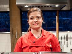 Judge and Chef Alex Guarnaschelli competes in this special competition and poses with her basket, as seen on Food Network’s Chopped All Stars, Season 14.

