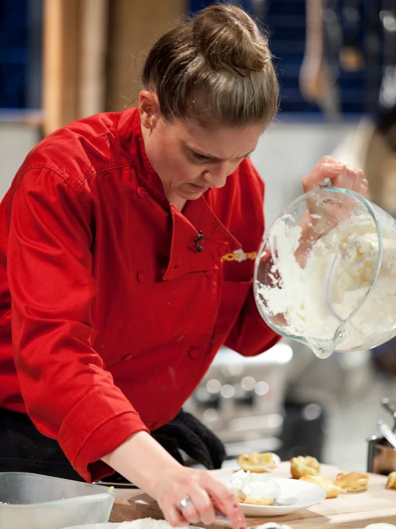Judge and Chef Amanda Freitag tops her dessert with whipped cream, as seen on Food Network’s Chopped All Stars, Season 14.