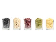 The glass of different legumes are  on a white background