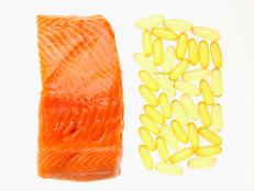 Salmon fillet and Omega 3-6-9 Fish oil capsules, overhead view
