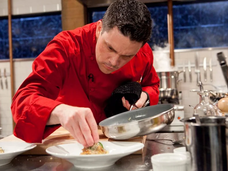 All-Star Chef Gavin Kaysen working on his appetizer that must include: soft shell crab, sake, chunky peanut butter and sea beans,as seen on Food Network's Chopped All-Stars, Season 14.