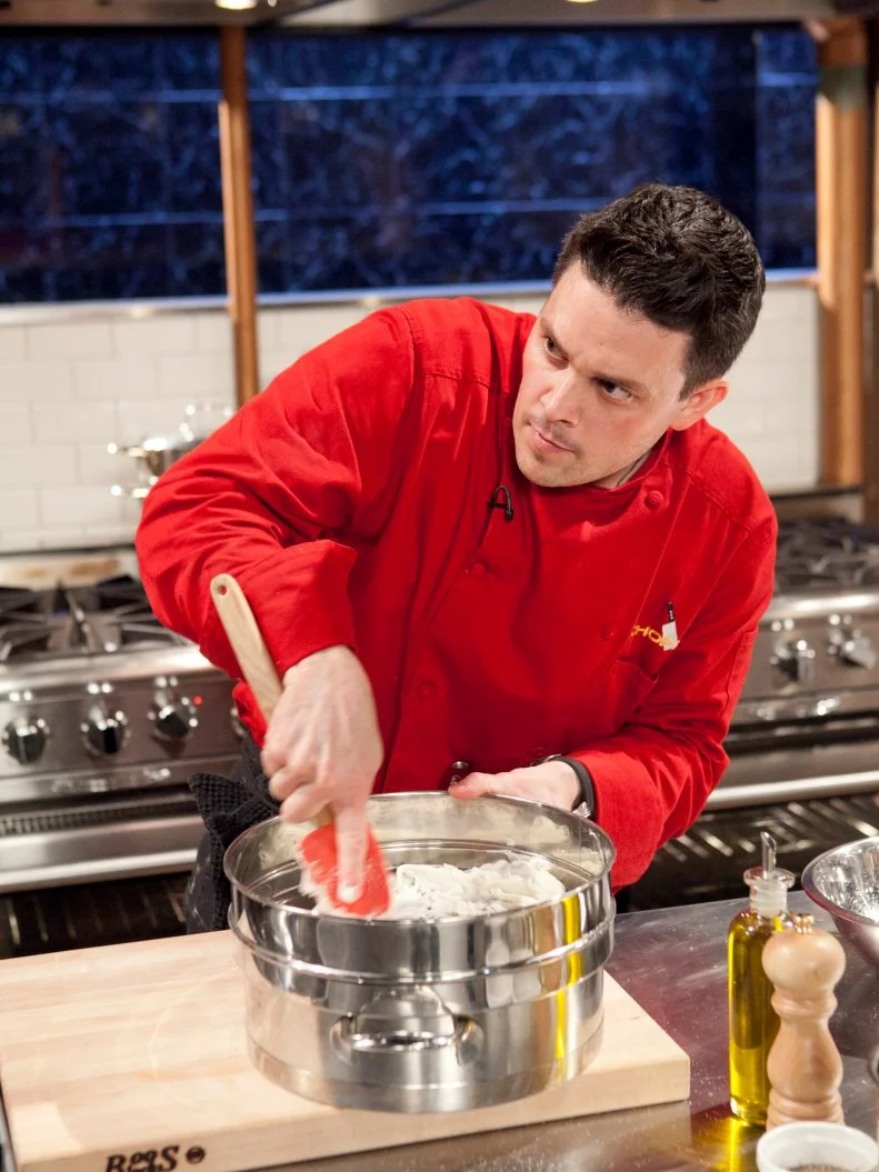All-Star Chef Gavin Kaysen working on his dessert that must include: freeze dried grapes, marrow bones, marcona almonds and cannoli cream,as seen on Food Network's Chopped All-Stars, Season 14.