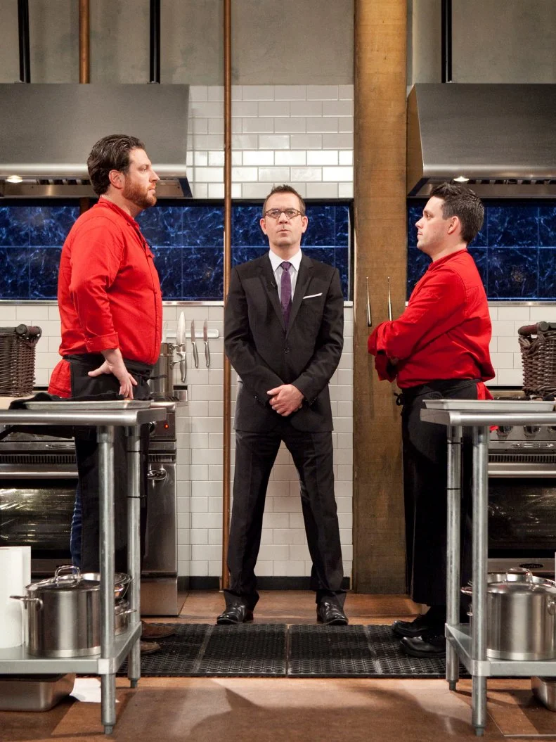 All-Star Chefs: Scott Conant and Gavin Kaysen stand next to host Ted Allen before starting the dessert round,as seen on Food Network's Chopped All-Stars, Season 14.