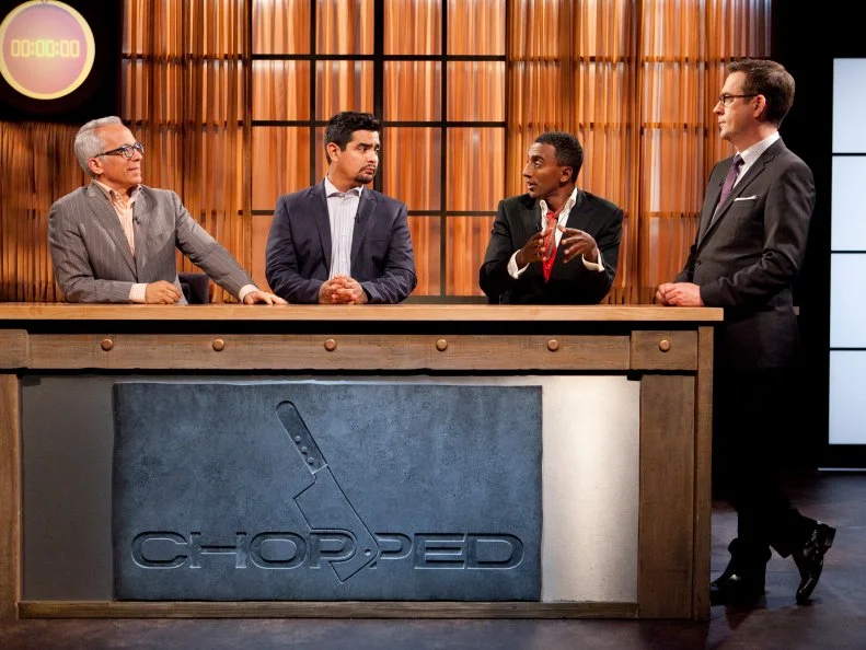 Host Ted Allen and judges: Geoffrey Zakarian, Aaron Sanchez and Marcus Samuelsson deliberate over the appetizers of the All-Star Chefs, as seen on Food Network's Chopped All-Stars, Season 14.