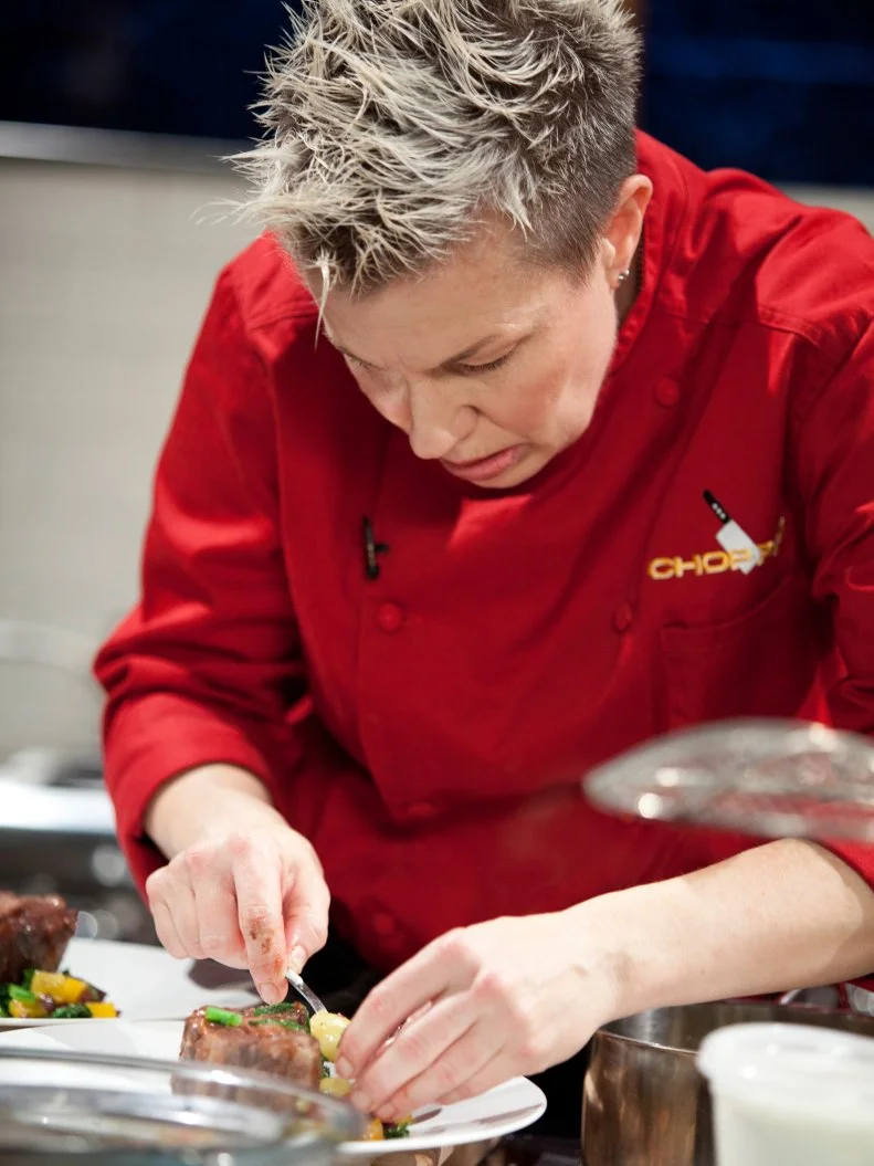Chef Elizabeth Falkner plates her dish, as seen on Food Network’s Chopped All Stars, Season 14.
