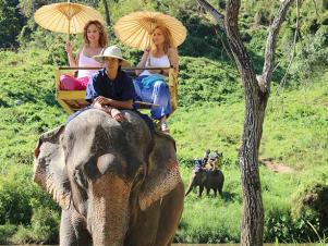 FNM_050113-Giada-Goes-to-Thailand-Riding-Elephant_s4x3
