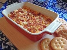 For your next party, treat friends and family to Trisha Yearwood's delicious cheese dip. opped with crispy bacon and buttery crackers, it’s an obvious crowd pleaser.