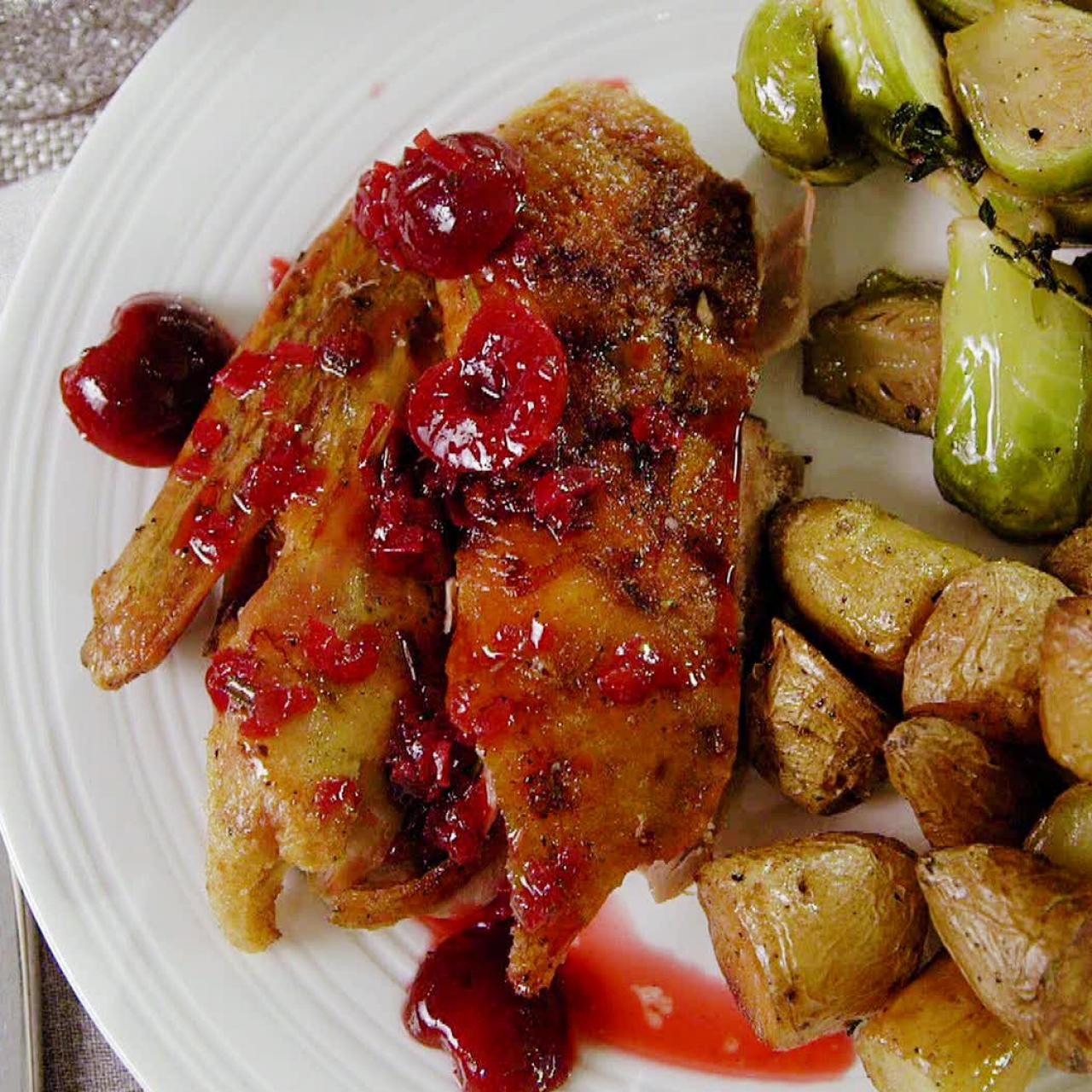 https://food.fnr.sndimg.com/content/dam/images/food/fullset/2013/5/15/0/ED0308H_crisp-tender-roast-duck-with-cherry-rosemary-sauce-recipe_s4x3.jpg.rend.hgtvcom.1280.1280.suffix/1371616521449.jpeg