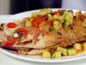 Moist roasted whole red snapper with tomatoes, basil and oregano.