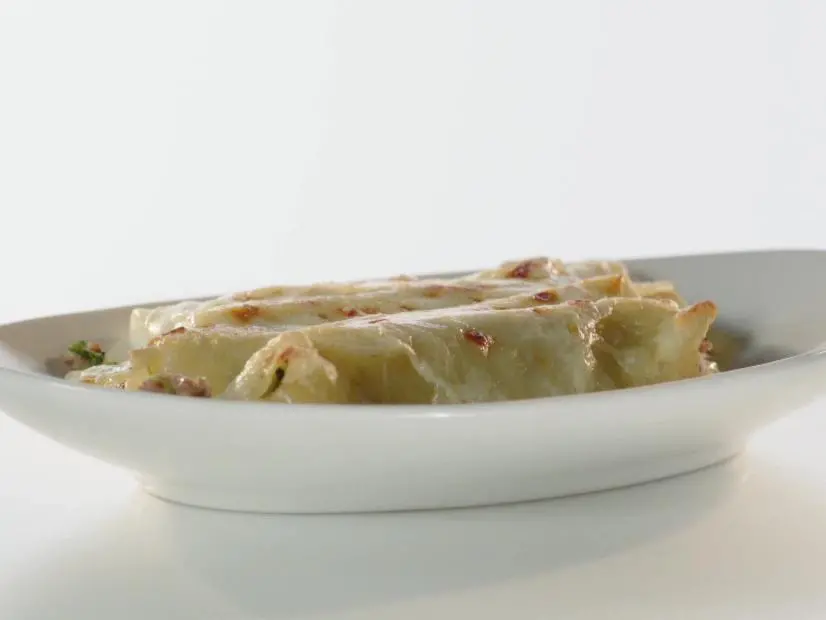 Cannelloni or stuffed shells with veal and sweet sausage.
