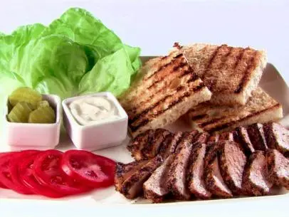 Pork sandwiches with white barbecue sauce.