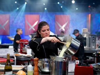 Next Iron Chef Winner, Iron Chef Alex Guarnaschelli during the battle of the secret ingredient potato chips in kitchen stadium for the Round Robin #2 battle, Iron Chef Geoffrey Zakarian vs. Next Iron Chef Winner, Iron Chef Alex Guarnaschelli, as seen on Food Network’s Iron Chef America, Season 11. New this season to Iron Chef America are two new elements. First both chefs have to have one dish prepared and presented to the judges by 20 minutes. The dish will be judged and viewers will know which chef has the advantage at this point. This will play into strategy for the rest of the episode. Also new this season is the Culinary Curve Ball when the Chairman will force the chefs to add either a new ingredient, new technique, or implement a new cooking tool or method.