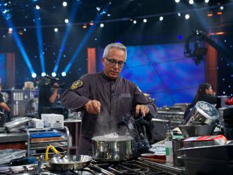 Iron Chef Geoffrey Zakarian during the battle of the secret ingredient potato chips in kitchen stadium for the Round Robin #2 battle, Iron Chef Geoffrey Zakarian vs. Next Iron Chef Winner, Iron Chef Alex Guarnaschelli, as seen on Food Network’s Iron Chef America, Season 11. New this season to Iron Chef America are two new elements. First both chefs have to have one dish prepared and presented to the judges by 20 minutes. The dish will be judged and viewers will know which chef has the advantage at this point. This will play into strategy for the rest of the episode. Also new this season is the Culinary Curve Ball when the Chairman will force the chefs to add either a new ingredient, new technique, or implement a new cooking tool or method.