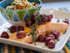 Serve oven-baked salmon with a tasty-yet-unexpected accompaniment: roasted grapes.