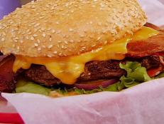 At this burger stop, Tyler Florence can't get enough of the "half-pound patties of beefy goodness." His favorite is the Phat Bob burger, which comes with bacon, BBQ sauce, mayo, onion rings, and Jack cheese. The hefty burger is so juicy that you just can't be afraid to get a little messy.