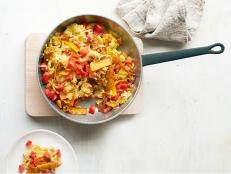 Make Sunny Anderson's San Antonio Migas, fluffy scrambled eggs with vegetables and cheese, from Food Network Magazine for an easy Meatless Monday dinner.