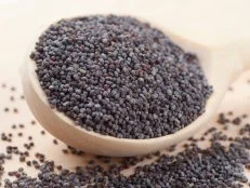 poppy seeds in wooden spoon