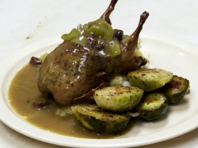 Andouille cornbread stuffed quail with red eye gravy and brussel sprouts.
