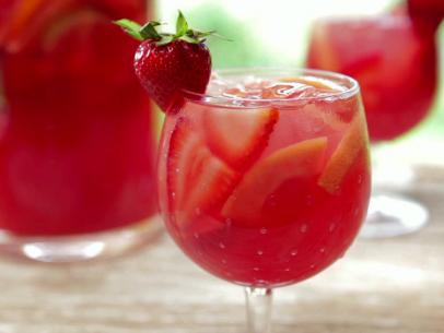 Strawberry pink grapefruit rose sangria garnished with a strawberry.