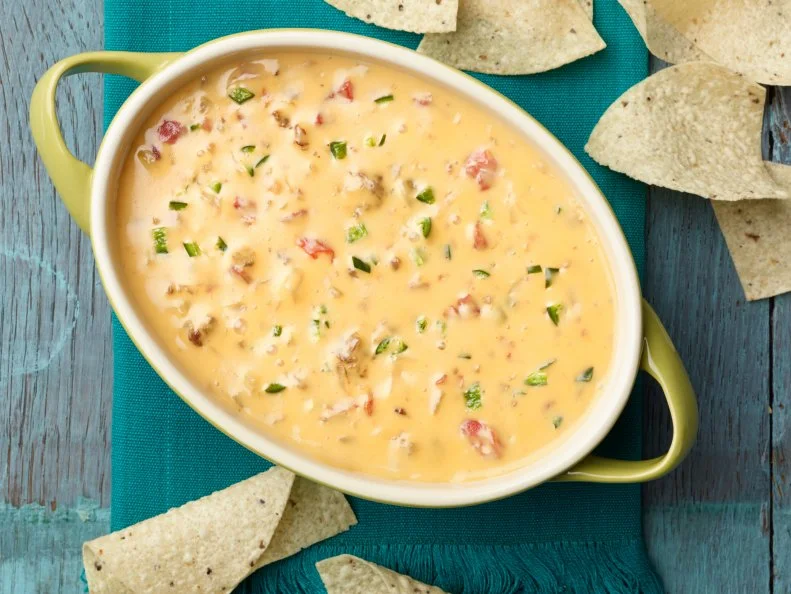 Chef Name: Ree DrummondFull Recipe Name: Chile Con QuesoTalent Recipe: Ree Drummondâ  s Chile Con Queso, as seen on The Pioneer WomanFNK Recipe: Project: Foodnetwork.com, HOLIDAY/SUPER BOWL/COMFORT/HEALTHYShow Name: The Pioneer WomanFood Network / Cooking Channel: Food Network