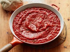 Pizza night is a breeze with Ree’s easy, homemade pizza sauce. Canned, crushed tomatoes save time while fresh basil, onion and garlic amp up the flavor. This recipe makes about 6 cups of sauce so feel free to freeze some for future use.