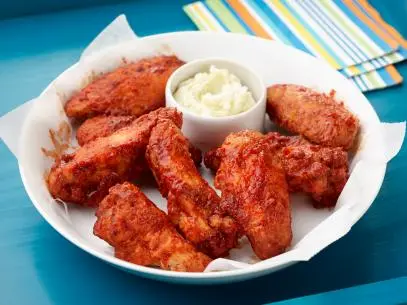 Chef Name: Geoffrey ZakarianFull Recipe Name: BBQ Chicken Wings with Blue Cheese Butter Talent Recipe: Geoffrey Zakarianâ  s BBQ Chicken Wings with Blue Cheese Butter, as seen on Food Networkâ  s The KitchenFNK Recipe: Project: Foodnetwork.com, CINCO/SUMMER/FATHERSDAY Show Name: The Kitchen