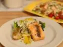 The dish recipe: Grilled salmon filets served with salad of orange segments, red onion, and shaved fennel and a side of grilled escarole. Grilled Salmon and Citrus-Fennel Salad as seen of Food Network's The Kitchen, Season 1.