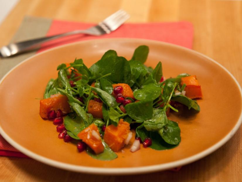 The recipe: Roasted cubed butternut squash, watercress, and pomegranate seeds tossed in a vinaigrette made with champagne vinegar, fresh ginger, and shallots. Butternut Squash and Watercress Salad with Champagne Ginger Vinaigrette as seen on Food Network's The Kitchen, Season 1.