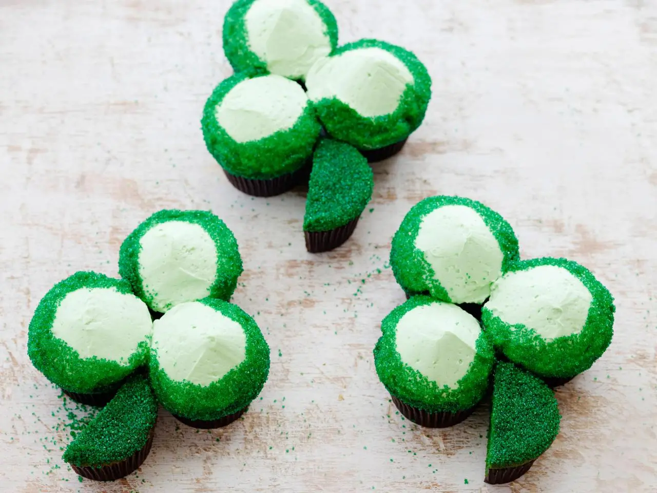 Shamrock-shaped green cupcakes