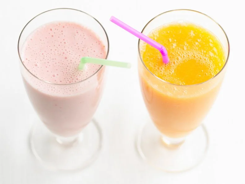 Strawberry and orange smoothie, studio shot
