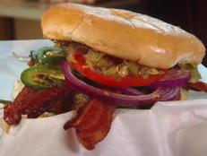 Owner Jack Perkins is grilling only burgers at his dive, and he is making over 600 a day. The half-pound burger with lettuce, bacon, cheese and jalapenos tantalized Guy's taste buds. Loyal customers enjoy customizing their burgers by adding an extra patty, chili, grilled onions and a fried egg.