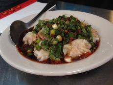 <p>At Blue Koi, two sisters cook up traditional Chinese dishes with some tasty twists. Guy devours an entire dish of the chili pepper wontons filled with a mouthwatering mixture of shrimp, pork and chicken and topped with chili sauce. Want even more heat? Add the firebird chicken noodles to your meal.</p>