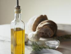 Bottle of Olive Oil, Bread and Garlic