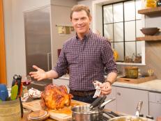 Bobby Flay on set with a his Roasted Turkey with Mustard Maple Glaze & Gravyas  seen on Food Network's Thanksgiving at Bobby's.