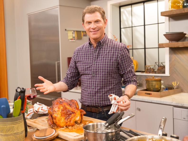 Bobby Flay on set with a his Roasted Turkey with Mustard Maple Glaze & Gravyas  seen on Food Network's Thanksgiving at Bobby's.