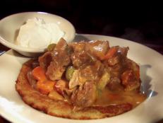 <p>If you can't make it to "the old country," Guy recommends stopping by the Polish Village Cafe. The Hungarian pancakes are fried and topped with a goulash made with pork butt. Guy loved the crunch from the pancakes and the "megatender" meat. Feeling adventurous? Try the tangy dill pickle soup.</p>