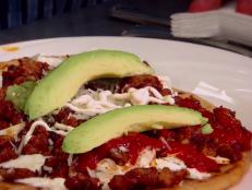 <p>Hidden behind a gas station is a small hole in the wall where Chef Rodrigo Albarran-Torres is using his mother's recipes to cook up some authentic Mexican food. Guy and Joe Theismann, former NFL quarterback, devoured the lamb taco enchiladas and tacos al pastor, praising the balance of flavors.</p>