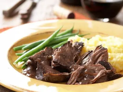The saying 'what grows together, goes together' is never more relevant than in this dish. The strong red wines of the Piedmont region meld perfectly into this hearty, classic Italian dinner.