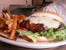 <p>At Athens Family Restaurant, owner Adel Elostta aims for the "best quality for the money." As Guy learned, that meant giant bacon lamb burgers (made with their "love spice" blend), gargantuan Greek suzukakia meatballs and kotopita, a tasty chicken turnover Guy called his kind of breakfast.</p>