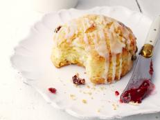 When I had a specialty-food store in East Hampton, NY, I learned lots of tricks for cooking and baking ahead. Every morning we made thousands of muffins and scones, and I discovered that we could make all the muffin batters the night before, refrigerate them and simply scoop them into muffin pans and bake them in the morning! I started using the same techniques at home: I love treating weekend guests to these cranberry-orange scones, but I also cherish the few mornings I get to sleep late, so I make the dough a day early, cut out the scones and refrigerate them. In the morning, all I do is throw them in the oven and then drizzle them with an orange glaze. Hot delicious scones for breakfast, and no stress!