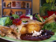 <p>Regulars describe the fare at Sophia's Place as "eclectic food with a New Mexican twist." But Guy called Chef Dennis Apodaca "Captain Electric." In his tiny kitchen, Dennis creates plates exploding with flavor, including scallop tacos and spicy duck enchiladas topped with a tomatillo sauce.</p>