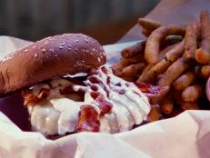 <p>At this eatery they're serving over 2000 burgers a week with a gourmet twist. The barbecue sauce in the half-pound Western Burger with pepper Jack, bacon, onion strings and jalapenos was the "kicker" according to Guy. He also enjoyed the venison and bison burger with a side of spicy fried pickles.</p>