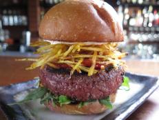 A highlight of this eatery’s eclectic menu is its Yakuza Burger. You’ll want to savor this American burger anointed with Asian flavors: The beef is seasoned with Japanese spices and the housemade mayo includes Sriracha for extra heat. Zesty fries piled on the patty make for a decadent finish.