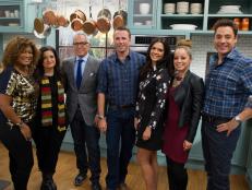 Co-hosts Geoffrey Zakarian, Katie Lee, Sunny Anderson, Jeff Mauro and Marcela Valladolid pose for a group portrait on set with guest chefs Marc Murphy and Alex Guarnaschelli, as seen on Food Networkâ  s The Kitchen, Season 4.