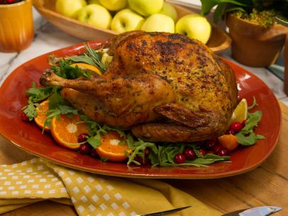 Food Beauty of crispy skinned herb roasted turkey on a Thanksgiving theme episode, as seen on Food Networkâ  s The Kitchen, Season 4.